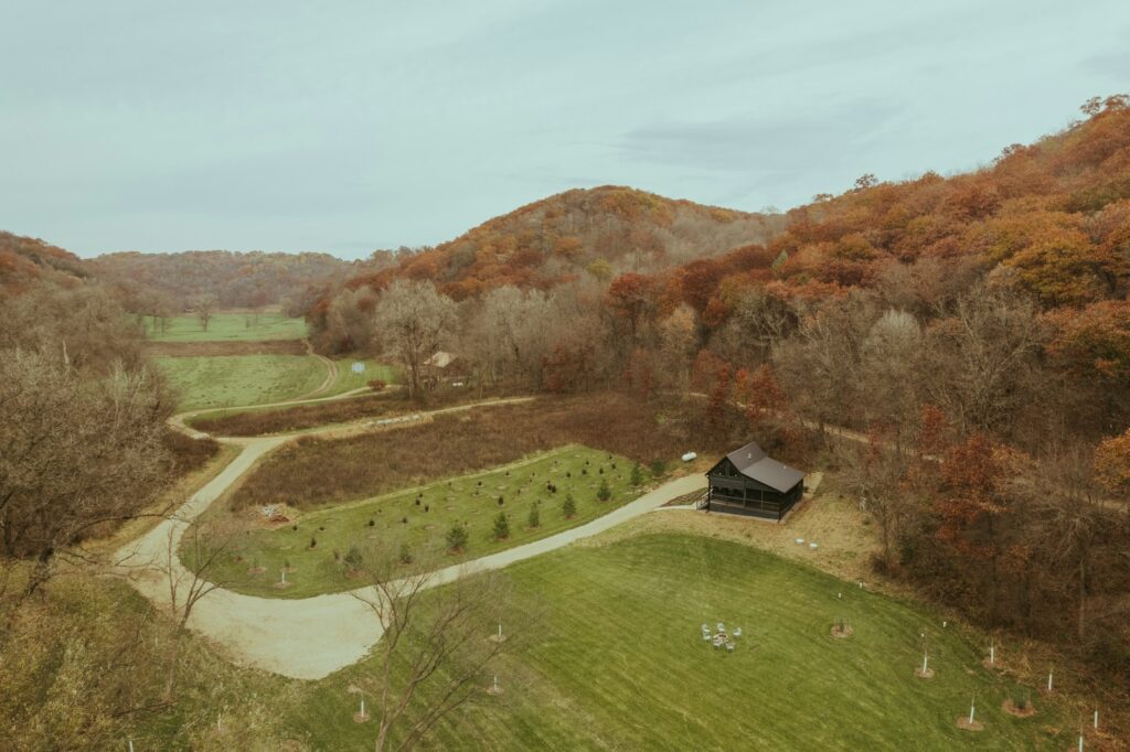 an aerial view of a farm in the fall